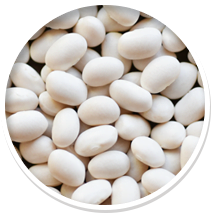 Close-up of white beans in a circular frame.